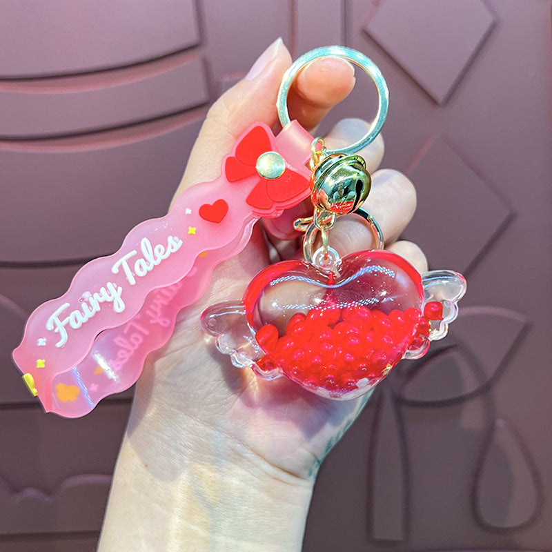 Wholesale Oil-infused Golden Bean Wing Heart Keychain